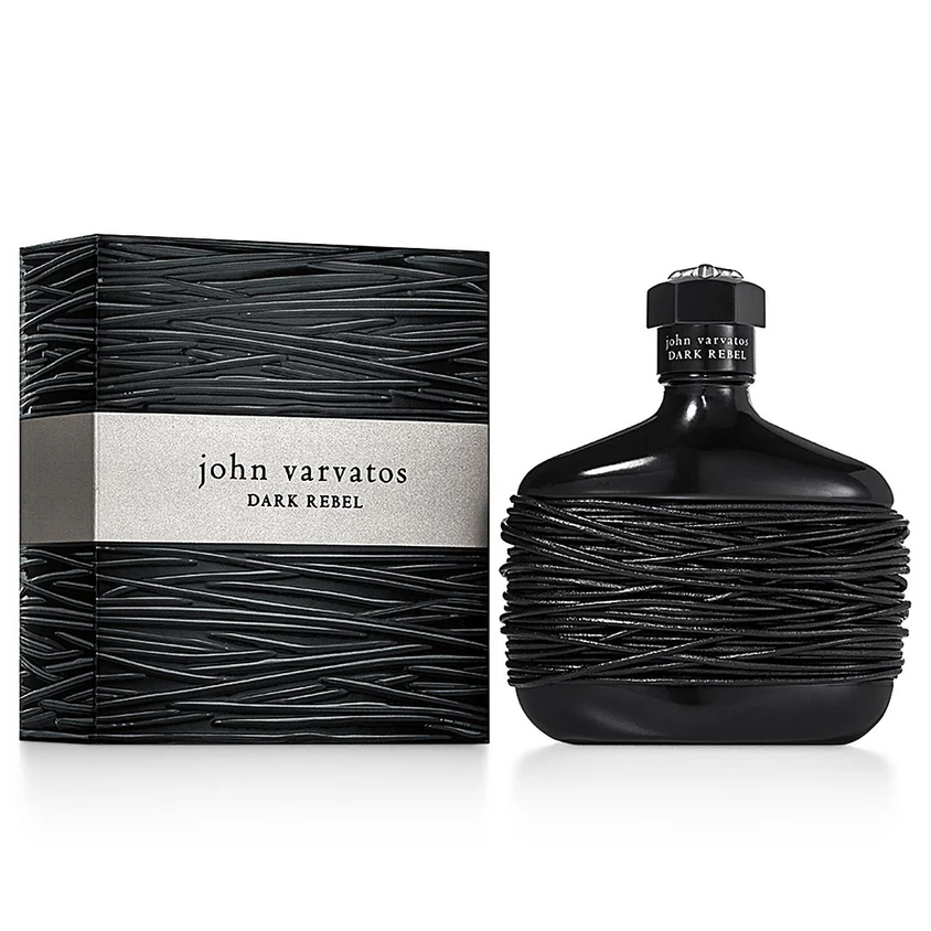 Dark Rebel by John Varvatos was introduced in September 2015 and stands for the designer’s return to his hometown Detroit. John Varvatos wants to inspire men to show their rebellious side and to think outside of the box. Advertised with the slogan: "From Darkness Comes Light", the flaçon already says it all. The black glass flaçon reflects all light, and it is impossible to see its contents while the black leather bands that are tightly wrapped around the bottle also keep out any illumination.